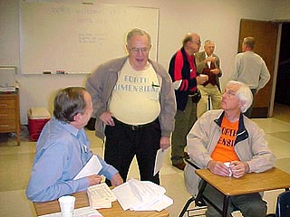 Bill Ragsdale, Bob Smith, and John Cassady engage in discussion.