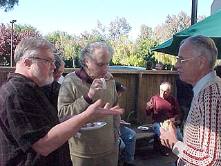 Bob Nash, Alan Furman, and John Peters enjoy a lunch discussion.
