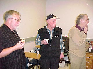 Bob Nash, Henrik Thurfjell, and Alan Furman at the coffee, bagels, and donuts table.